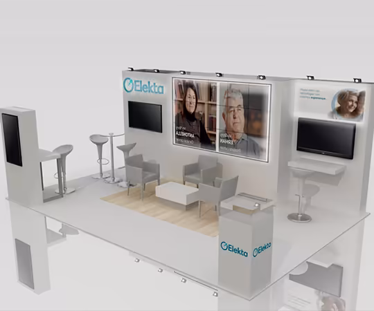 Stand de Elekta en una feria comercial con zonas para sentarse, expositores promocionales con imágenes de personas y señalización de marca en un diseño moderno y minimalista.